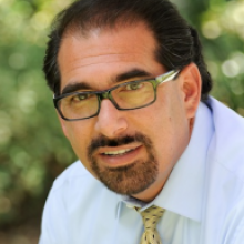 Colored headshot of Dr. Ziyad (Zee) H. Duron wearing a white button up shirt and yellow tie